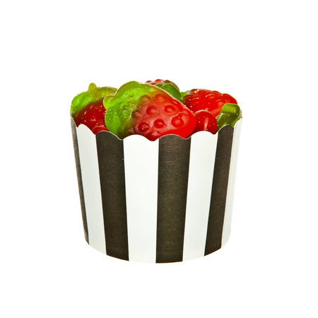 Strawberry flavour Jelly candies and a black and white paper cupの写真素材