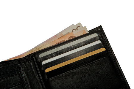 Black leather wallet with euro notes and credit cardsの写真素材