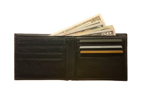 Black leather wallet with dollar notes and credit cardsの写真素材