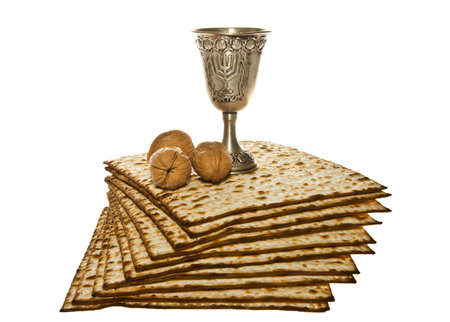 Matzoth, silver Kiddush cup and three walnuts for Passover sederの写真素材