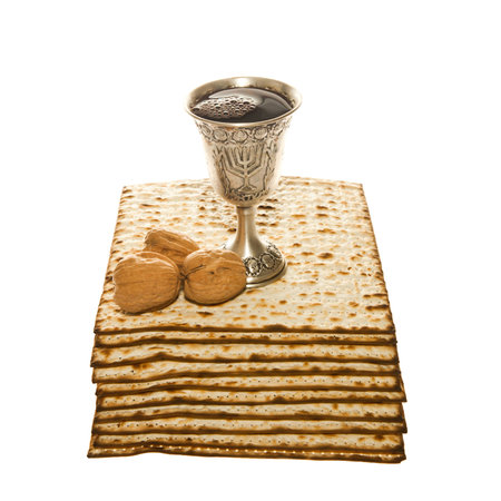 Matzoth, silver Kiddush cup and three walnuts for Passover sederの写真素材