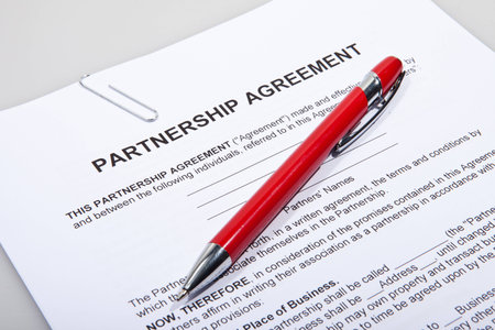 Partnership agreement forms with red penの写真素材