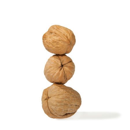 Stack of three raw walnuts の写真素材
