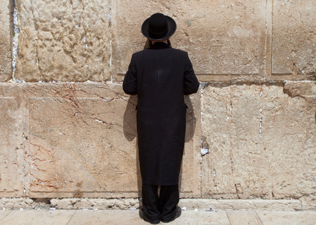 Orthodox Jewish Man prays at the western wall, Jerusalemの写真素材