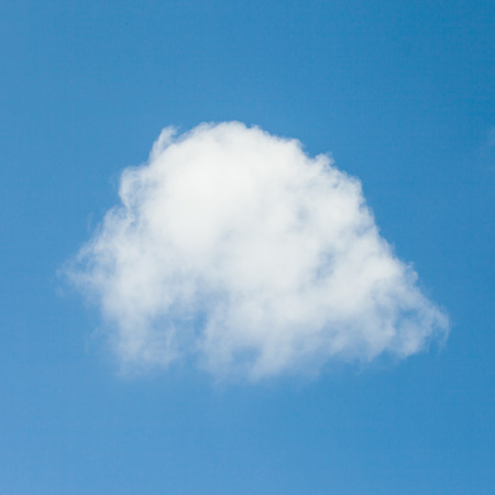 Blue sky with single cloudの写真素材