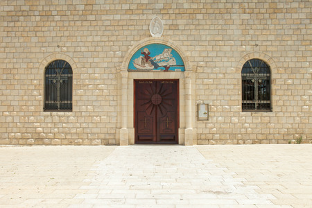 Church entrance with stone wall and stone floorの写真素材