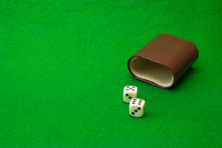 Green casino table with dice backgroundの写真素材