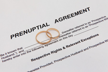 Prenuptial agreement with ringsの写真素材