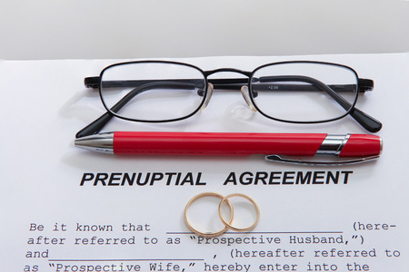 Prenuptial agreement with ringsの写真素材