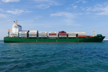 Medium sized container ship leaving the portのeditorial素材