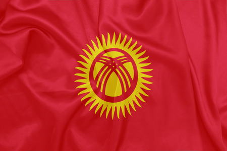 Kyrgyzstan - Waving national flag on silk textureの写真素材