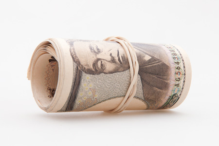 Japanese yen notes on white background imageの写真素材