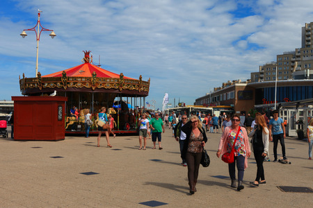 Locals and Tourists at Scheveningen's famous boardwalk, known for it's restaurants and shops. Scheveningen is one of the eight districts of The Hague.のeditorial素材