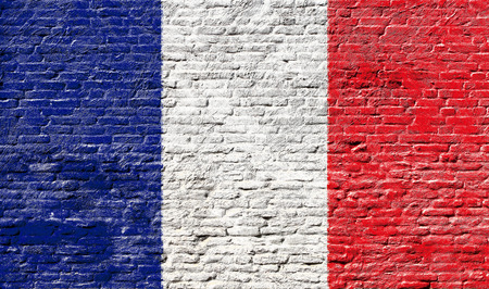 France - National flag on Brick wallの写真素材