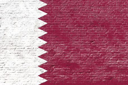 Qatar - National flag on Brick wallの写真素材