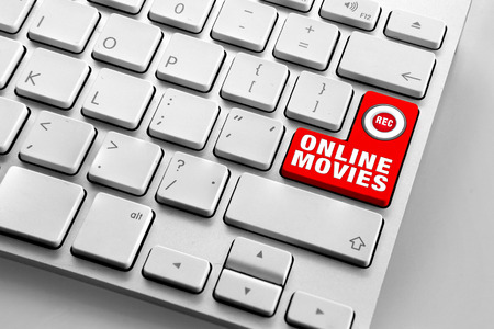 Computer keyboard with red online movies buttonの写真素材