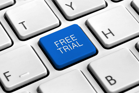 Computer keyboard with blue free trial buttonの写真素材