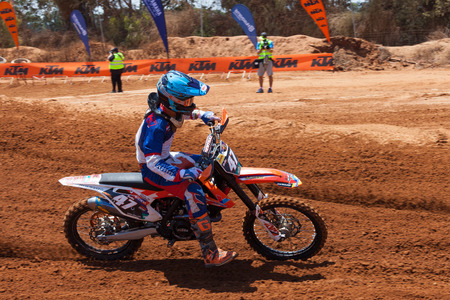 Motocross rider take on a tight but fast turn during the final heat of the race.のeditorial素材