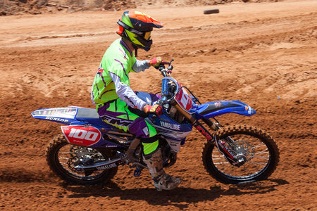 Motocross rider take on a tight but fast turn during the final heat of the race.のeditorial素材