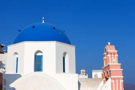 White houses and blue domes of Oia, Santorini.の写真素材