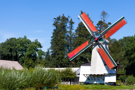Classic Dutch windmills in nature with blue sky in the backgroundの写真素材