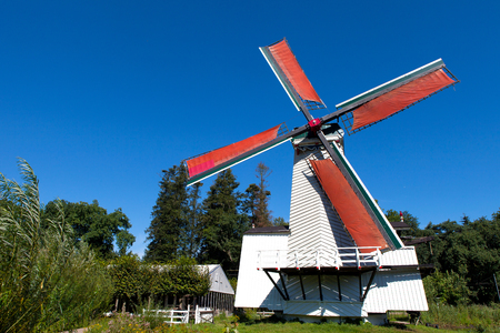 Classic Dutch windmills in nature with blue sky in the backgroundの写真素材