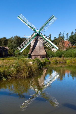 Classic Dutch windmills in nature with blue sky in the backgroundの写真素材