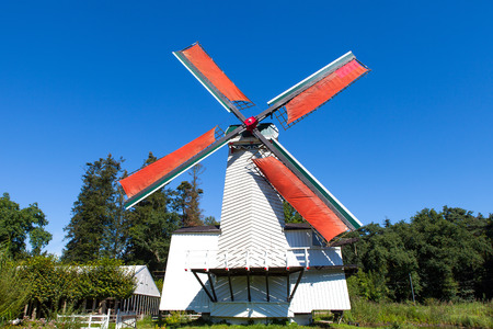 Classic Dutch windmills in nature with blue sky in the backgroundの写真素材