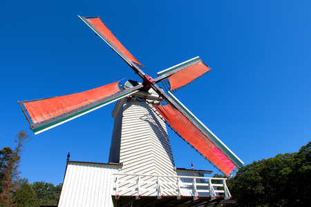 Classic Dutch windmills in nature with blue sky in the backgroundの写真素材