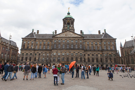 Dam square on a sunny day with locals and touristsのeditorial素材
