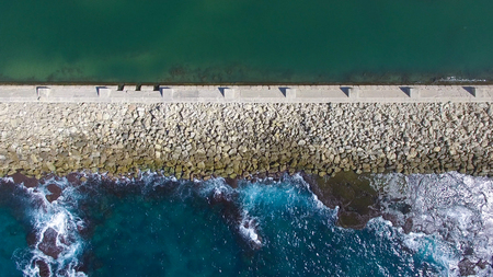 Aerial photo of a Breakwater showing both sides of the effectの写真素材