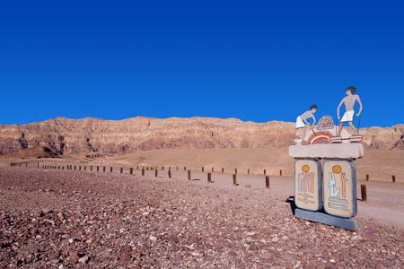Empty desert road with mountains and blue sky in the backgroundの写真素材