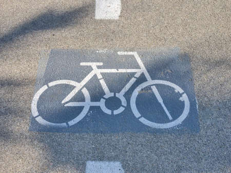 White Bicycle lane mark on an Asphalt road.の写真素材