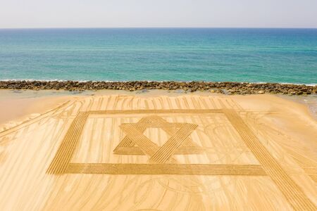 Flag of Israel designed in beach sand for independence day during Corona Virus lockdown.の写真素材