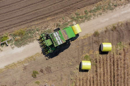 Aerial image of a Large Cotton picker harvesting a field.のeditorial素材
