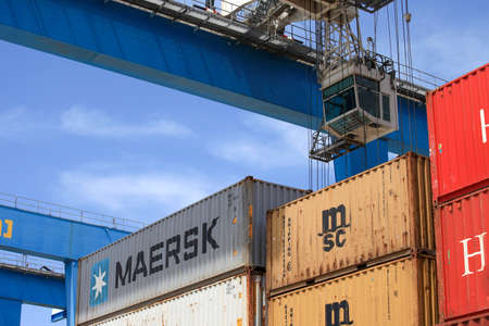 Shipping Containers stacked at a holding platform.