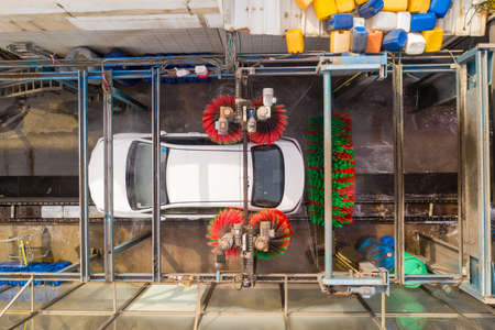 Carwash scene, Top down aerial view of a man washing an unmarked carのeditorial素材