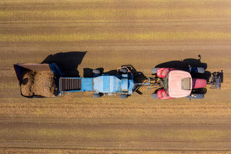 Almond picker harvester processing a field, Aerial view.の写真素材