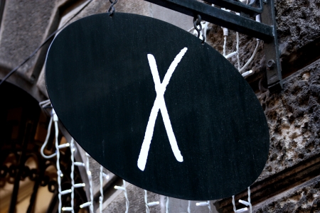 Shop black sign with white xの写真素材
