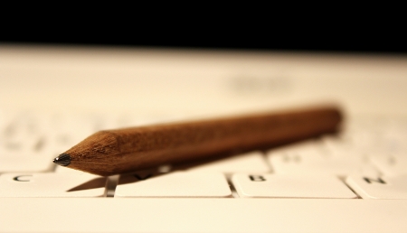 Pencil on a keyboardの写真素材