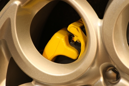 Car wheel detail with yellow brakeの写真素材