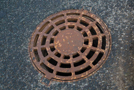 Original cast iron sewer manholeの写真素材