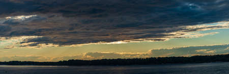 Low stormy skies at sunsetの写真素材