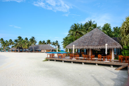 There is a tropical sea view restaurant on the white beach of the resortのeditorial素材