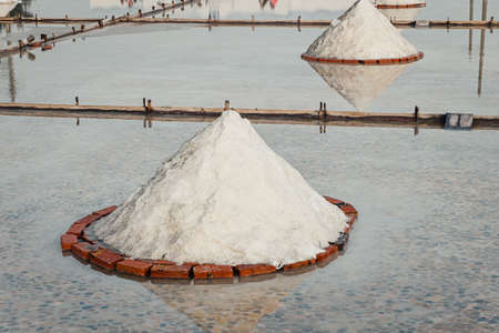 Piles of salt concentrated in Taiwan's traditional salt panの写真素材