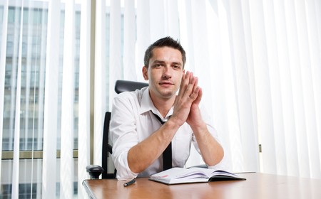 Real office worker posing for cameraの写真素材