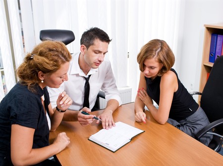 Manager with office workers on meeting in board room Hi Resの写真素材