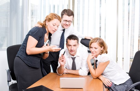 Manager with office workers on meeting in board room Hi Resの写真素材
