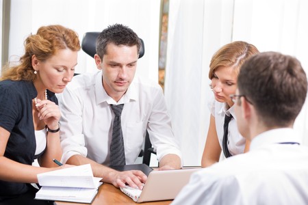 Manager with office workers on meeting in board room Hi Resの写真素材