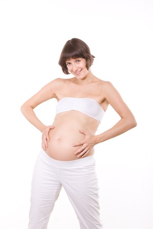 Portrait of happy pregnant woman in studio の写真素材